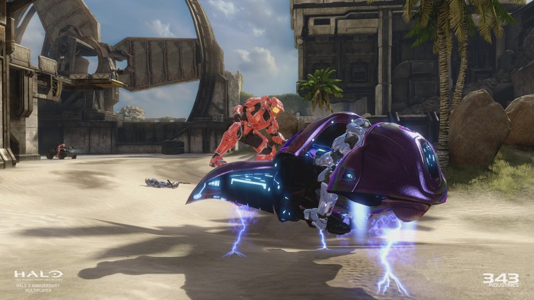 In-game screenshot from the multiplayer for Halo 2. A player from the Red Team is about to hijack a Ghost from another player from the Blue Team.